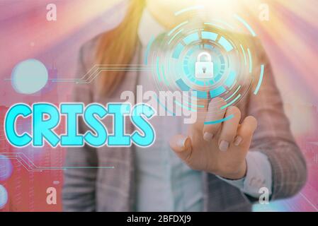 Writing note showing Crisis. Business concept for time when difficult or important decision must be made danger Stock Photo