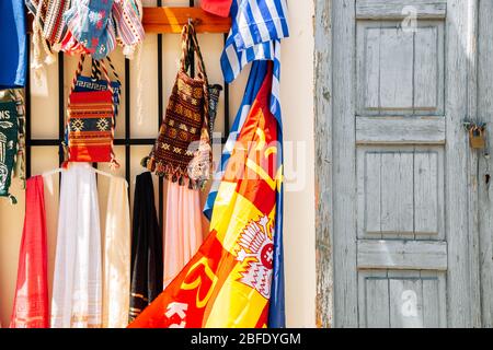 Street souvenir shop, colorful scarves and bags in Athens, Greece Stock Photo