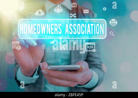 Handwriting text writing Homeowners Association. Conceptual photo Organization with fee for upkeeps of Gated Community Stock Photo