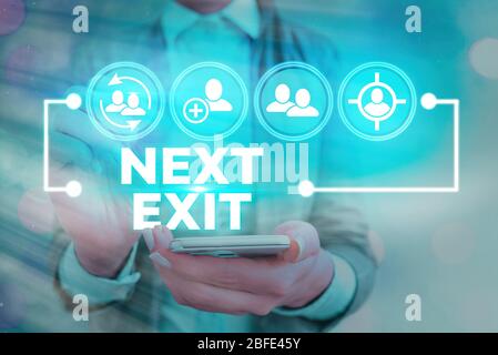 Writing note showing Next Exit. Business concept for the following way out or act of leaving in a place or highway Stock Photo