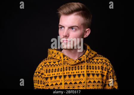 Portrait of young blond bearded man wearing hoodie Stock Photo