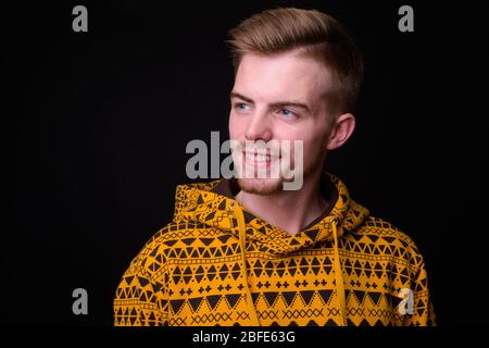 Portrait of young blond bearded man wearing hoodie Stock Photo