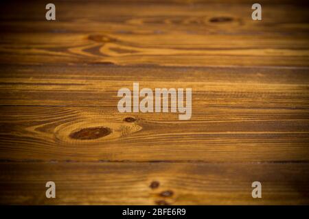 brown wooden background from natural wood with dark knots Stock Photo