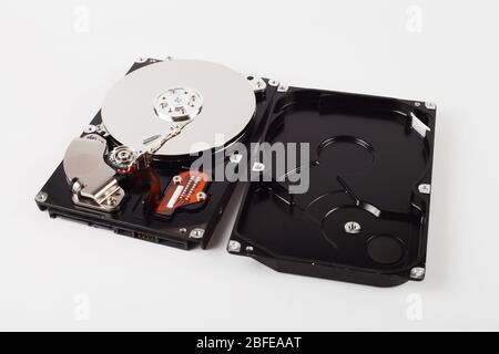 Disassembled hard drive on white background Stock Photo