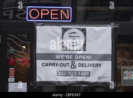 Washington, United States. 18th Apr, 2020. A sign on a restaurant says 'open' in north Dupont Circle in Washington, DC on Friday, April 17, 2020. Many restaurants and bars in DC have closed while others find creative ways to stay in business during the Covid-19 shutdown. Depending on how long the shutdown will last, some say 30% to 50% of the DC restaurants and bars will not be able to reopen. Photo by Pat Benic/UPI Credit: UPI/Alamy Live News Stock Photo