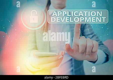 Writing note showing Application Development. Business concept for creation of Computer Apps for use on Mobile Devices Stock Photo