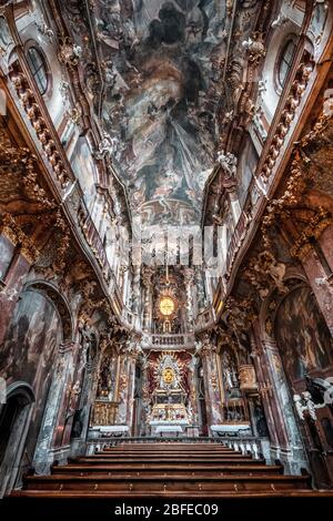 Feb 2, 2020 - Munich, Germany: Interior of Asamkirche baroque church with altar and ceiling view Stock Photo