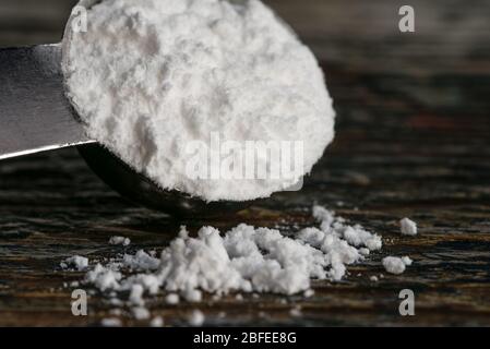 Powdered Sugar Spilled from a Teaspoon Stock Photo