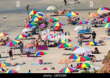 domestic and forign tourists enjoying in the beaches of papanasam,varkala,thiruvananthapuram,kerala,india,pradeep subramanian,beach tourism,papanasam Stock Photo