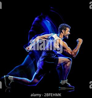 one caucasian player man exercising fitness cardio boxing exercise body combat studio shot isolated on black background with light painting blur effect Stock Photo