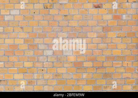 Beige or yellow dutch clinker wall texture small old stones Stock Photo