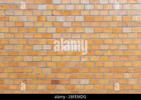 Dutch clinker stone brick facade texture beige and yellow colored small bricks Stock Photo