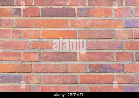 Red and orange dutch clinker brick facade close up picture Stock Photo