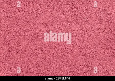 Texture of red painted and plastered building facade shot Stock Photo