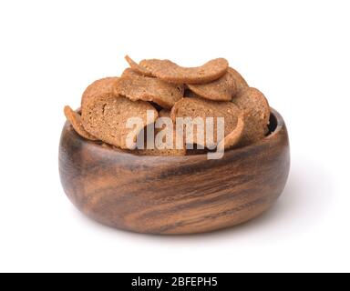 Wooden bowl of rye bread chips isolated on white Stock Photo