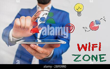 Conceptual hand writing showing Wifi Zone. Concept meaning provide wireless highspeed Internet and network connections Stock Photo