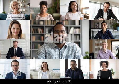 Laptop screen webcam view diverse people engaged in group videocall Stock Photo