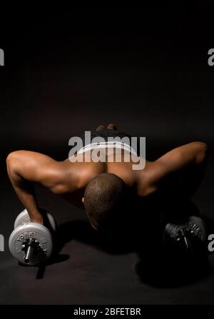 A man exercising by doing push-ups Stock Photo