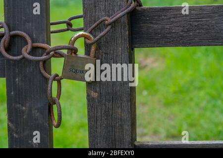 Old Rusty Chain and Padlock on Gate Stock Photo