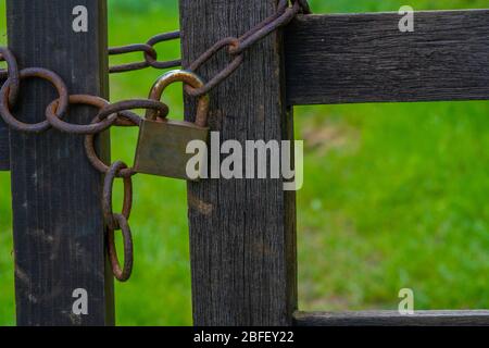 Old Rusty Chain and Padlock on Gate Stock Photo