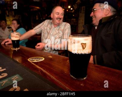 Customers enjoy Guinness in Hells Kitchen Pub, Castlerea, County Roscommon, Ireland. Stock Photo