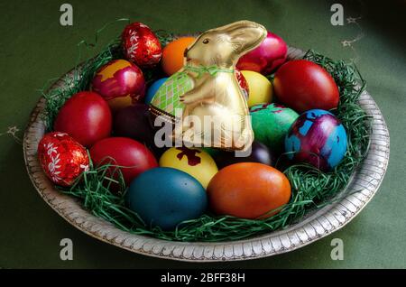 Decorated color Easter eggs and chocolate rabbit Stock Photo