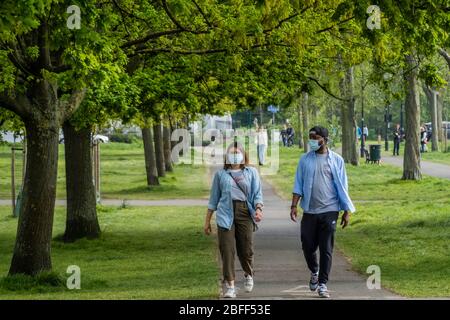 London, UK. 18th Apr, 2020. Clapham Common is pretty quiet now as it is colder and Lambeth Council has taped up all the benches, put up signs and organised patrols by wardens. The 'lockdown' continues for the Coronavirus (Covid 19) outbreak in London. Credit: Guy Bell/Alamy Live News