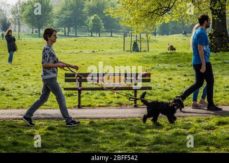 London, UK. 18th Apr, 2020. Clapham Common is pretty quiet now as it is colder and Lambeth Council has taped up all the benches, put up signs and organised patrols by wardens. The 'lockdown' continues for the Coronavirus (Covid 19) outbreak in London. Credit: Guy Bell/Alamy Live News Stock Photo