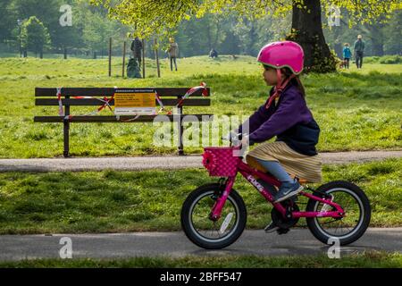 London, UK. 18th Apr, 2020. Clapham Common is pretty quiet now as it is colder and Lambeth Council has taped up all the benches, put up signs and organised patrols by wardens. The 'lockdown' continues for the Coronavirus (Covid 19) outbreak in London. Credit: Guy Bell/Alamy Live News Stock Photo