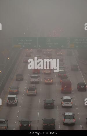 Above traffic on a Los Angeles freeway in thick smog fog Stock Photo