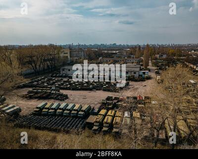 Old rusty broken Russian military cars for scrap metal, aerial view