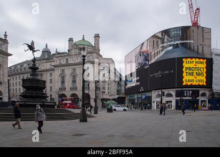 London, UK. 18th Apr, 2020. Government messages to stay at home during the coronavirus pandemic are shown on the digital billboard in Piccadilly Circus, London, UK on April 18, 2020. (Photo by Claire Doherty/Sipa USA) Credit: Sipa USA/Alamy Live News Stock Photo