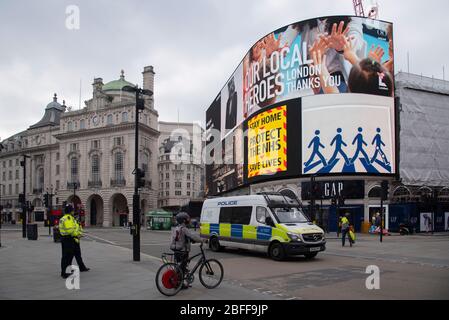 London, UK. 18th Apr, 2020. Government messages to stay at home during the coronavirus pandemic are shown on the digital billboard in Piccadilly Circus, London, UK on April 18, 2020. (Photo by Claire Doherty/Sipa USA) Credit: Sipa USA/Alamy Live News Stock Photo