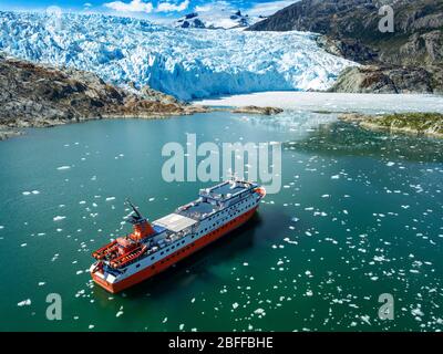 Aerial view of  El Brujo Glacier On The Edge Of The Sarmiento Channel in Bernardo O'Higgins National Park in Patagonia Chile fjords near Puerto Natale Stock Photo