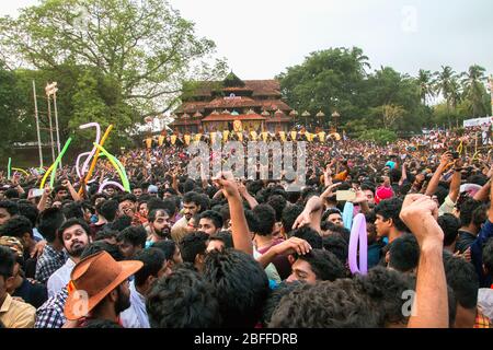 caparisoned elephants decorated deities embedded in golden Kolams held with colorful umbrellas from thrissur pooram,kerala,india Stock Photo