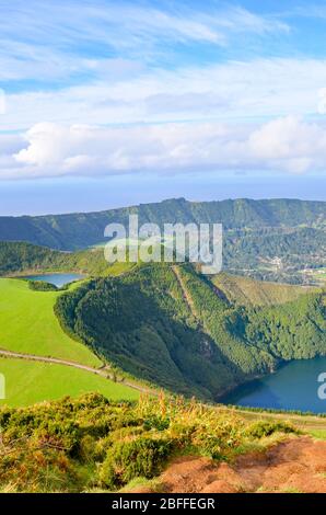 Viewpoint Miradouro da Boca do Inferno in Sao Miguel Island, Azores, Portugal. Amazing crater lakes surrounded by green fields and forests. Beautiful Portuguese landscape. Tourist destination.