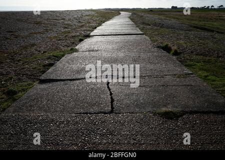 Wartime concrete road Shingle Street Suffolk UK Stock Photo