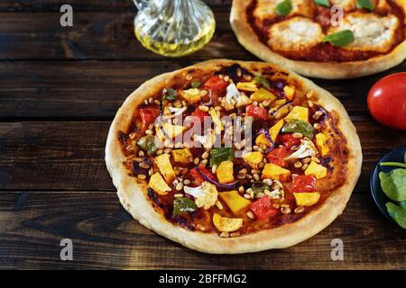 Two vegan pizzas on dark rustic background Stock Photo