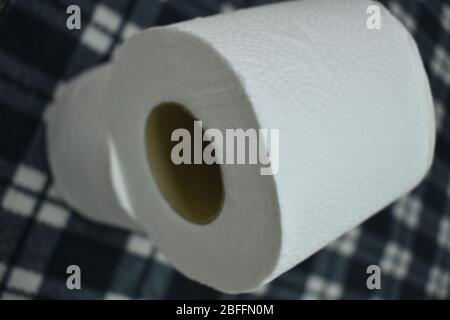 Closeup view of Toilet paper rolls isolated in black background Stock Photo