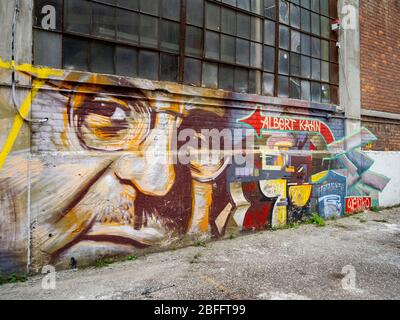 A colorful mural on the wall of the Russell Industrial Center in Detroit, MI, pays tribute to Albert Kahn, the architect who designed the center in 1915. The center now contains studios and lofts and serves as a professional center for commercial and creative arts. Stock Photo