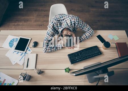 High angle above view photo of business guy computer monitor day and night reliable secretary fell asleep working place tired wear casual shirt sit Stock Photo