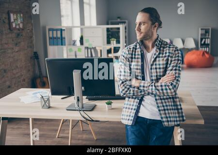 Photo of handsome business administrator guy leaning table arms crossed look side window inspiration moment wear casual shirt standing spacious modern Stock Photo