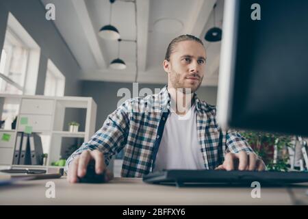 Photo of handsome business manager guy look computer monitor table read report planning team building corporate meeting wear casual shirt suit sitting Stock Photo