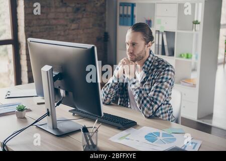 Photo of handsome business manager guy look computer monitor table seriously read corporate report wear casual shirt suit sitting chair modern Stock Photo