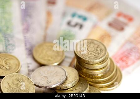 Illustrative image of various denomination sterling notes and coins. Stock Photo