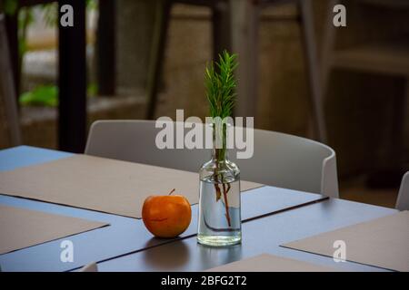 Beautifully decorated table with apple and pine branch in the restaurant Stock Photo