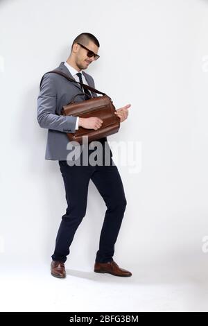 Portrait of successful and confident music lover guy having fun. Happiness, success, business concept. Stock Photo