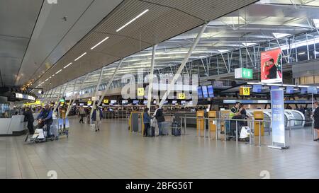 Schiphol airport departure hall,people tourists and workers,indoors amsterdam  Stock Photo