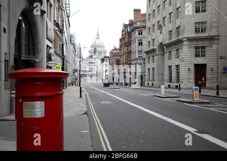 London, UK. 18th Apr, 2020. Day Twenty Six of Lockdown in London. Fleet Street is almost deserted in a very quiet central London for a Saturday as the country is on lockdown due to the COVID-19 Coronavirus pandemic. People are not allowed to leave home except for minimal food shopping, medical treatment, exercise - once a day, and essential work. COVID-19 Coronavirus lockdown, London, UK, on April 18, 2020 Credit: Paul Marriott/Alamy Live News