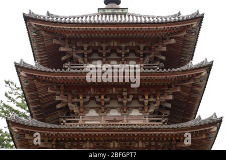 Looking up at the curved roof and intricate construction of the oldest wooden building,the five-story Goju-no-to pagoda, in Kyoto,Japan, completed 951 Stock Photo